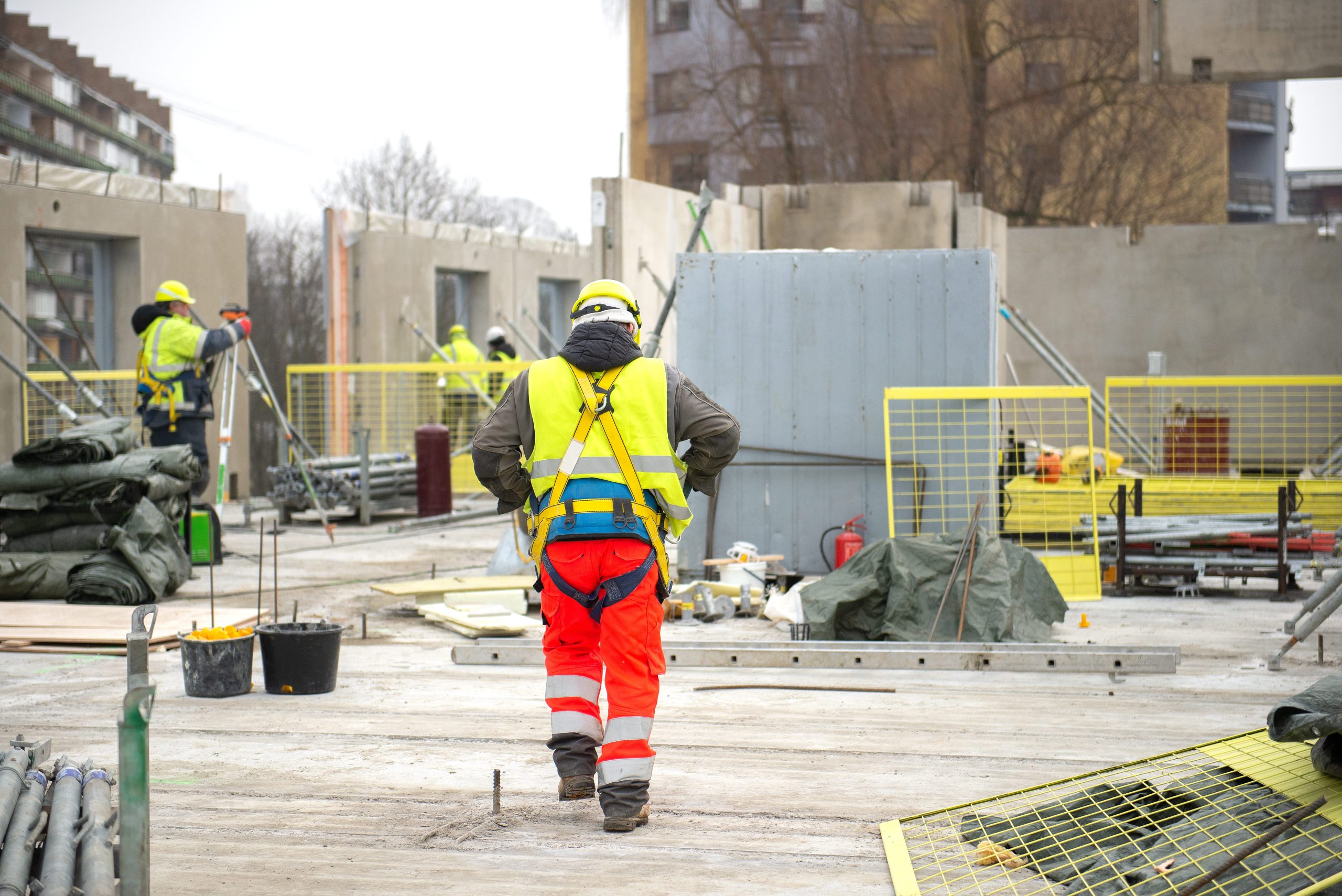 rear-view-of-male-builder-construction-worker-on-b-2025-03-08-19-45-59-utc